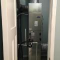 A properly sized high-efficiency heat pump is located in conditioned space in a closet inside the home.