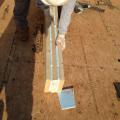 Insulated splines consisting of boards layered with rigid foam minimize energy loss at joints between the SIP wall panels. 