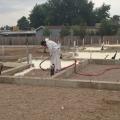 The builder’s crews spray foam directly onto the ground to provide a vapor barrier and insulation layer under the slab.