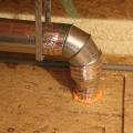 A rigid metal duct vents the exhaust fan. 