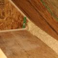 Right - Spray foam insulates the attic eave between the attic floor and the SIP roof panel.