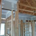 Drywall is installed before framing in dropped soffits to provide an air barrier above these duct chases.  
