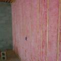 Unfaced batt insulation completely fills the wall cavities.