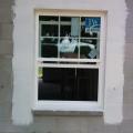 A paint-on flashing is used around the windows and doors for seamless water protection.  
