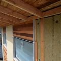 Rigid mineral wool insulation is covered with ¼-inch wood battens which provides a air and drainage gap under the cedar and fiber cement siding.