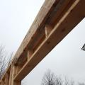 A layer of rigid foam is sandwiched between two layers of 2x8 lumber in this insulated header over a window.