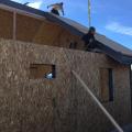 Because all of the structural load is carried by the SIP roof and wall panels, no trusses are needed, allowing the home to have vaulted ceilings and open interiors throughout.