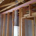 A foam gasket is installed along the top plates before installing drywall as an air-sealing step to help achieve a quieter, draft-free home.