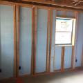 This Kalamazoo Habitat for Humanity affiliate installs one layer of foam exterior of the studs and a second layer in between the staggered studs which are set only 2 inches apart to simplify the installation of additional fiberglass batt insulation.