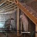 Cellulose insulation is sprayed into wall cavities.
