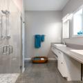 This bathroom is handicapped accessible with a zero-entry shower and roll-up sinks.