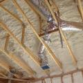 Right – R-25 of open-cell spray foam lines this new home’s attic ceiling, to protect HVAC ducts from heat and cold. 
