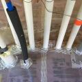 Plumbing penetrations through the below slab insulation are sealed with tape and spray foam.