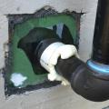 Right - Peel and stick flashing and flashing tape seal a plumbing pipe that penetrates an exterior wall.