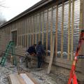 Furring strips are installed over a foil-faced rigid foam sheathing to provide a drainage plane and ventilation gap behind siding.