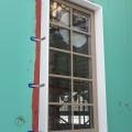 Framing is built around the window before exterior rigid foam is installed on the exterior walls around the window.