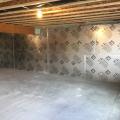 Right - The conditioned basement is insulated on the interior with 1 inch of polyiso R-6.3 rigid insulation.