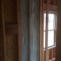 This builder installs spray foam in exterior wall cavities where tubs and showers will be installed to air seal and insulate the exterior wall. 