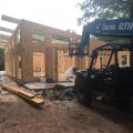 Right – Structural insulated panels are quickly assembled on site for this SIP house.