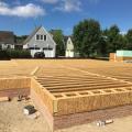 Right – Strips of SIP panels are used to sheath and insulate the rim joists.
