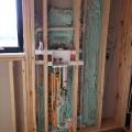 Right – Spray foam is used to carefully seal behind plumbing that was installed in an exterior wall.