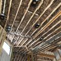 Right - The ceiling joists of the cathedral ceilings in this dry-climate home are filled with fiberglass batt insulation.