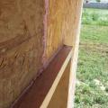 Right - The seams in the OSB sheathing are sealed with a sprayer-applied sealant.
