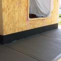 Right – The base of the wall is water proofed and the seam between the base of the wall and the sidewalk is air sealed.