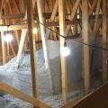Right – Plastic tenting increases the height of the insulation above ducts that are located in the attic.