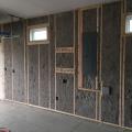 Right – Blocking is installed next to the electrical panel for future mounting of the PV inverters.