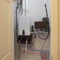 Right – The home’s energy management system is installed in a utility closet next to the tankless water heater.
