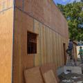 Right - Plywoood sheathing is taped at the seams to create a continuous air barrier that prevents air infiltration through critical junctures in the wall, such as at corners and between floors.