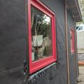 Right - Tape flashing keeps moisture out around and below the window; extra tape reinforces the corners to prevent tearing of the house wrap and to keep water out of this critical juncture. 
