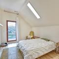 Right - Skylights provide natural light while maintaining privacy in a narrow second-story bedroom. 
