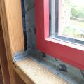 Right – Interior wood-to-wood seams around a window are sealed with tape to prevent air leakage. 