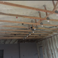Right – The underside of this low-sloped roof is insulated with open-cell spray foam in this dry climate to achieve the code-required R-value; the builder used the same foam to insulate exterior walls. 