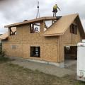 Right – A mall crew with a crane can assemble a home of structural insulated panels (SIPs) in just a few days. 