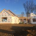 Right - House wrap is overlapped “shingle” style to direct moisture down and away from the house; seams will be taped so house wrap serves as both an air and weather barrier.