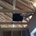 Right – This exhaust fan use metal ducting that goes directly to the soffit to minimize penetrations through the roof. 