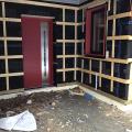 Right – Vertical and horizontal furring strips are installed over a breathable membrane weather resistant barrier to create an air gap and drainage plane behind the wood siding that will be installed next. 