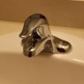 Right – The PEX piping and sink drain of this bathroom sink are fitted with escutcheons that help to air seal around the pipes and prevent pest entry.