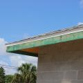 Right – This hot-humid climate home employs several hurricane- and termite-resistant features including concrete block construction, borate-treated framing, a hip roof design with metal drip edge, impact-rated windows, and an unvented attic. 