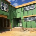 Wrong – the sheathing tape is properly installed to cover all seams in the coated sheathing but the flexible sill flashing product is not consistently installed or fully adhered around the window sills and is missing or lapped at some corners. 