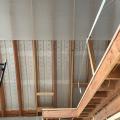 Right – Baffles are foamed in place between the roof joists of the vented, vaulted attic to direct air from the soffit vents up to the ridge vent.