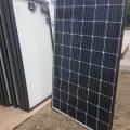 Right – Photovoltaic solar panels are ready for installation on the roof of a DOE Zero Energy Ready certified home. 