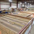 Right – Walls, windows, and wiring are installed in the factory for these modular homes, which are installed at the site on basement foundations made of insulated concrete wall panels.