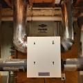 Right – This energy recovery ventilator provides fresh air and exhausts stale air through a heat exchanger that recovers heat from the outgoing air in winter and reduces heat from incoming air in the summer to provide ventilation without wasting energy. 