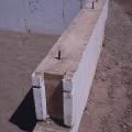 Right – Insulated concrete forms (ICFs) provide the insulated stem wall for the slab-on-grade foundation for this SIP house. 