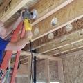 Right – Holes were drilled into the I joists between floors to run the small-diameter HRV ducts.