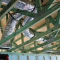 Flex ducts are properly installed with support straps and correctly connected to duct boots with a tension tie on the inner liner and approved metal tape over the foil vapor cover.